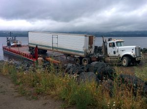 Barging out a supply trailer to the Killdog site on Quesnel Lake