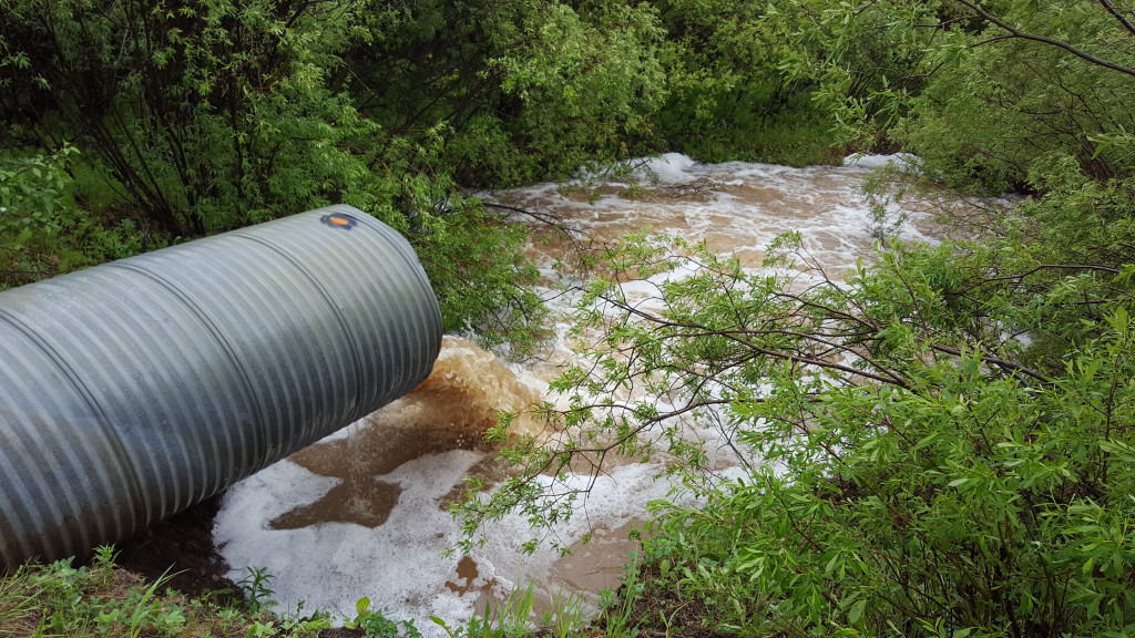 Photo of a flooded culvert with pipe
