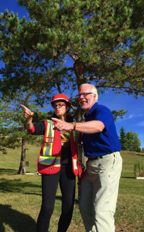 woman and man pointing