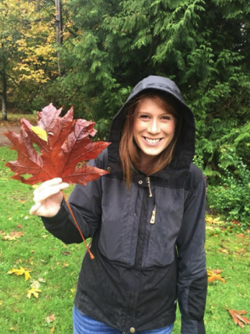 woman holding maple leaf