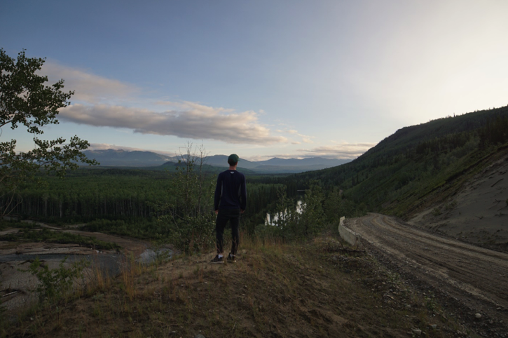 man standing on top of mountain