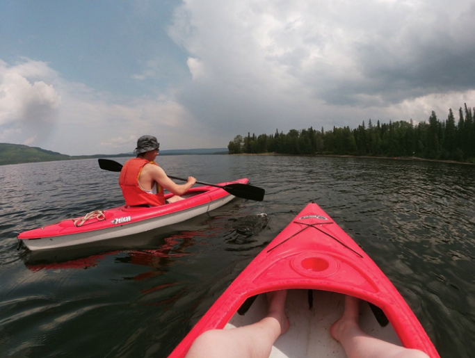 two people kayaking in the lake