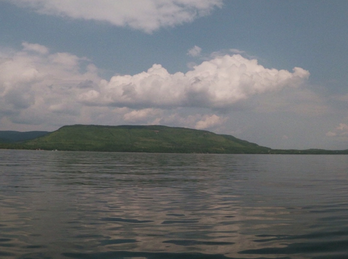 view  of lake with island in the distance