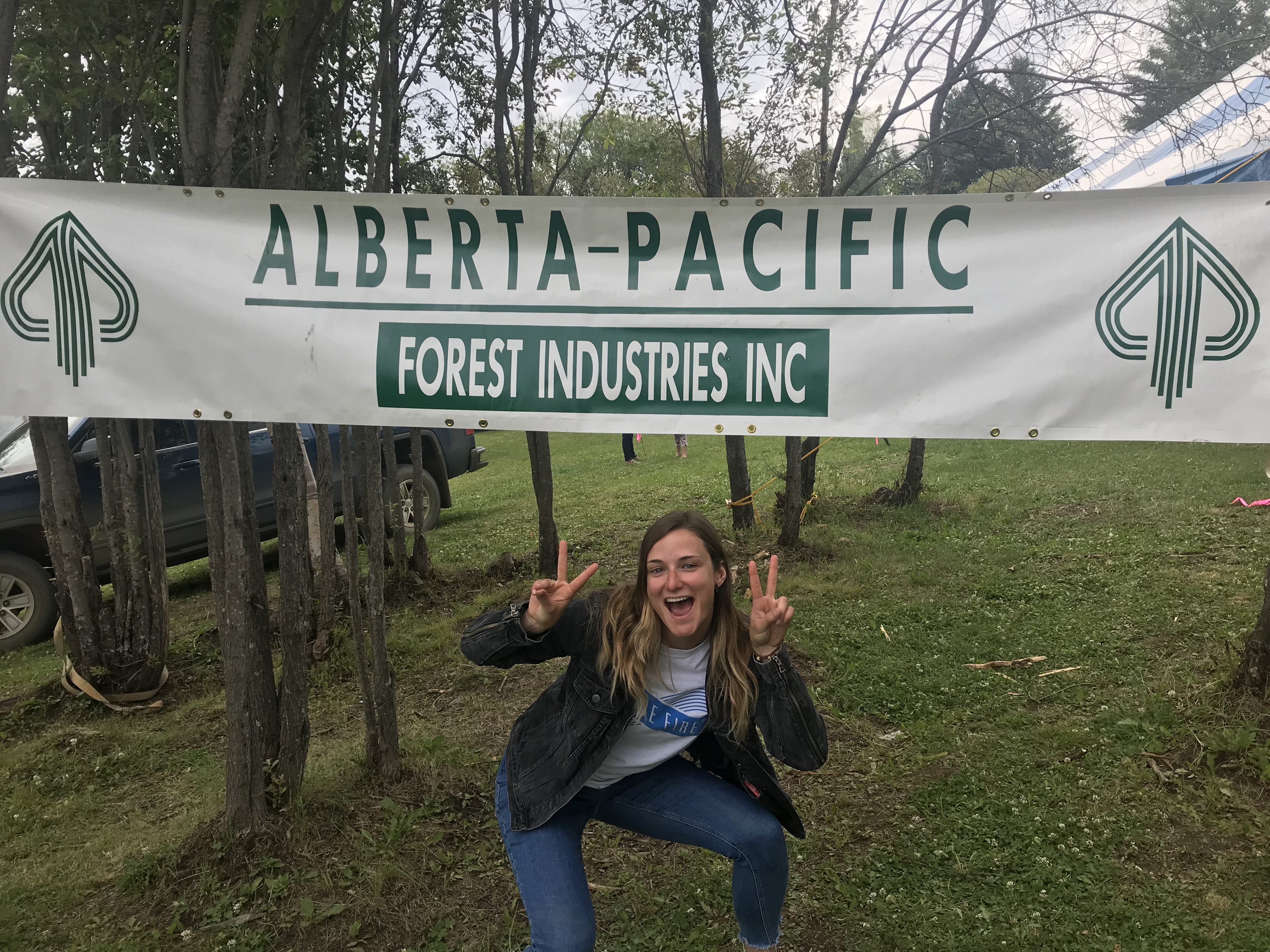 girl with alberta-pacific sign